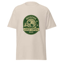 Natural Color unisex T-shirt featuring a vintage-style graphic for the "Queens Golf Open 2025." The design includes the Unisphere at the center, surrounded by silhouettes of iconic NYC buildings, a golf ball, and a flagstick. The text "QUEENS GOLF OPEN 2025" is prominently displayed in cream and green tones within a badge-like emblem.