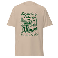Queens Country Club T-shirt featuring vintage-style golf squirrel mascot driving a golf cart with NYC skyline, Unisphere, and Queensboro Bridge in background. Swingin' in the Borough golf streetwear for New York golfers