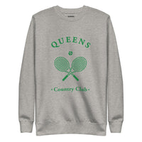 Queens Country Club crewneck sweatshirt with green graphic of crossed tennis rackets and ball. Vintage-inspired NYC tennis streetwear blending classic country club style with Queens sports culture