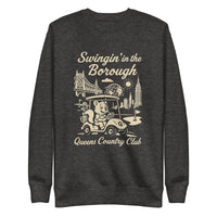 Black Queens Country Club sweatshirt with cream graphic showing a squirrel driving a golf cart, Queensboro Bridge, Unisphere, and NYC skyline; text reads “Swingin’ in the Borough – Queens Country Club.”