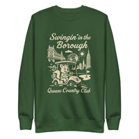 Black Queens Country Club sweatshirt with cream graphic showing a squirrel driving a golf cart, Queensboro Bridge, Unisphere, and NYC skyline; text reads “Swingin’ in the Borough – Queens Country Club.”