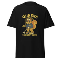  Queens Country Club black graphic T-shirt featuring cartoon golf squirrel mascot 'Muni Squirrel' in retro golf outfit with QCC sweatshirt, standing in front of Unisphere. Golf streetwear inspired by NYC municipal courses
