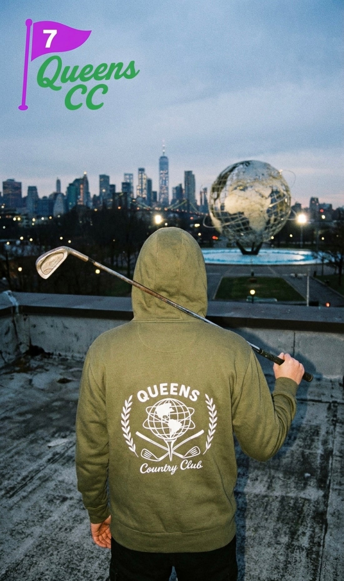 Model wearing QCC golf ball tee hoodie looking at nyc skyline and queens unisphere 