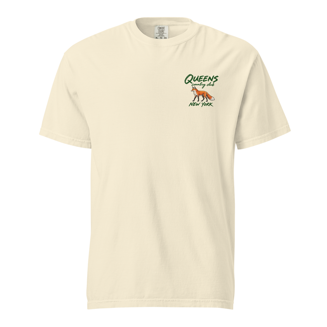 QCC Fairway Fox Tee in Ivory, front view: orange fox below green Queens Country Club lettering, with New York beneath, on the left chest.