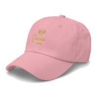 Pink cap with gold logo and text | Queens Country Club
