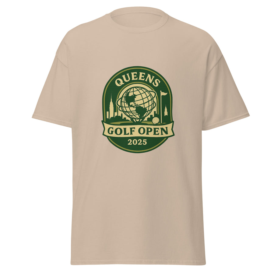 Sand Color unisex T-shirt featuring a vintage-style graphic for the "Queens Golf Open 2025." The design includes the Unisphere at the center, surrounded by silhouettes of iconic NYC buildings, a golf ball, and a flagstick. The text "QUEENS GOLF OPEN 2025" is prominently displayed in cream and green tones within a badge-like emblem.